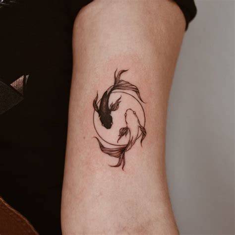 yin yang wrist tattoo|yin yang fish tattoo meaning.